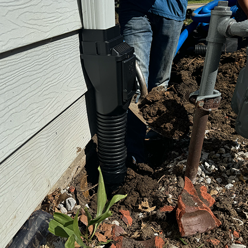 Backfilling around downspout adapter